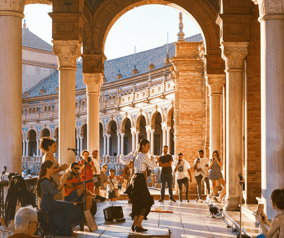 Flamenco dancer and musicians performing at Plaza de España in Seville, a vibrant cultural experience for Spain travel destinations and flamenco in Seville 2025.