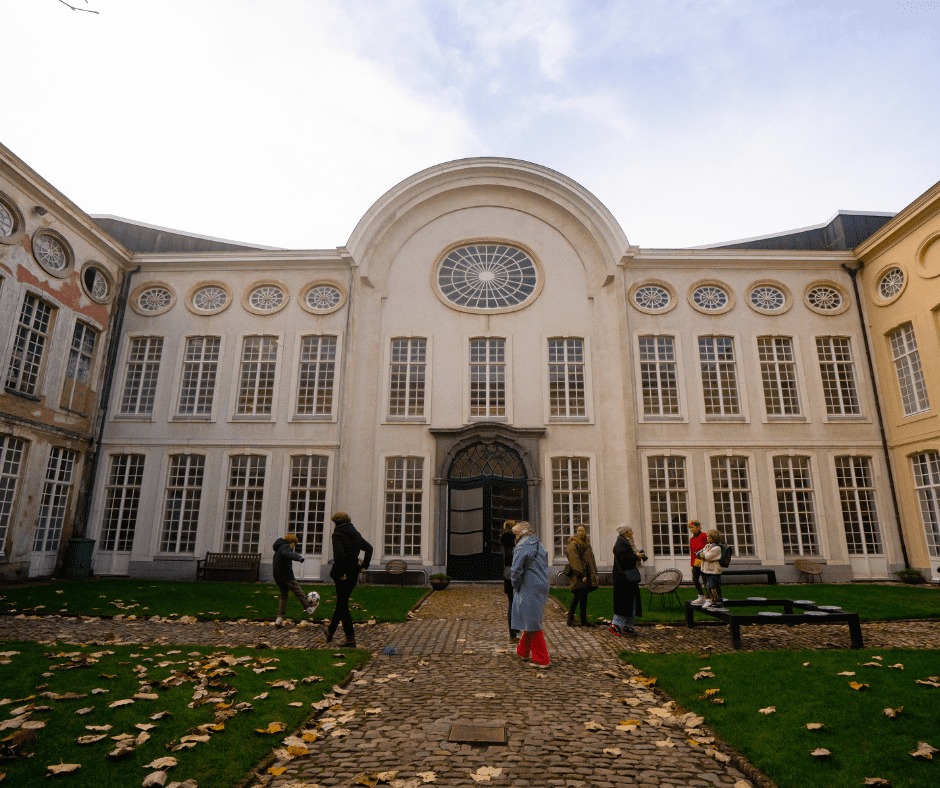 Here’s SEO-friendly and descriptive alt text for that image: **Alt Text:** Exterior of Design Museum Gent in Ghent’s old town during winter, showcasing its blend of historic architecture and modern design focus.