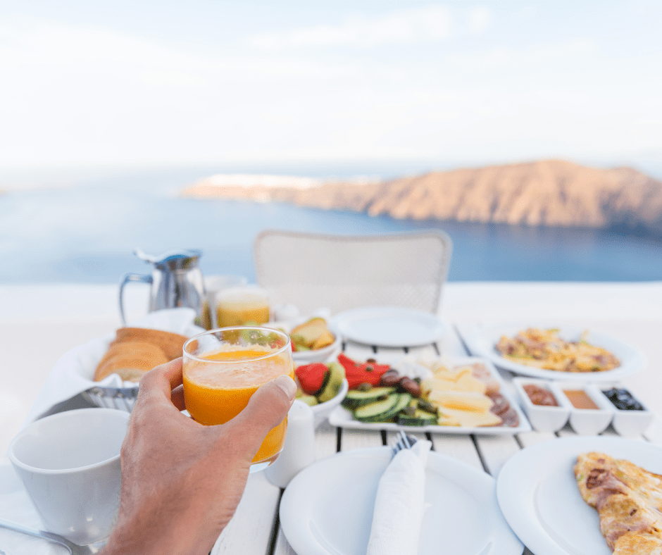 Selfie of a healthy European vacation breakfast with fresh fruit, yogurt, whole grain bread, and coffee—capturing the balance and simplicity of the European diet.