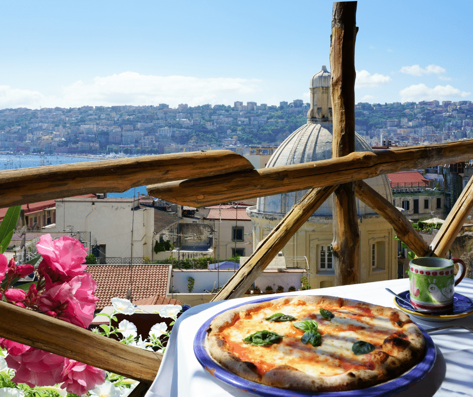 pizza overlooking the naples skyline, the birthplace of pizza