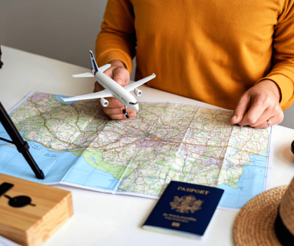 Travel planning concept with map, passport, and airplane model for a Milan–Cortina 2026 base-and-pivot itinerary