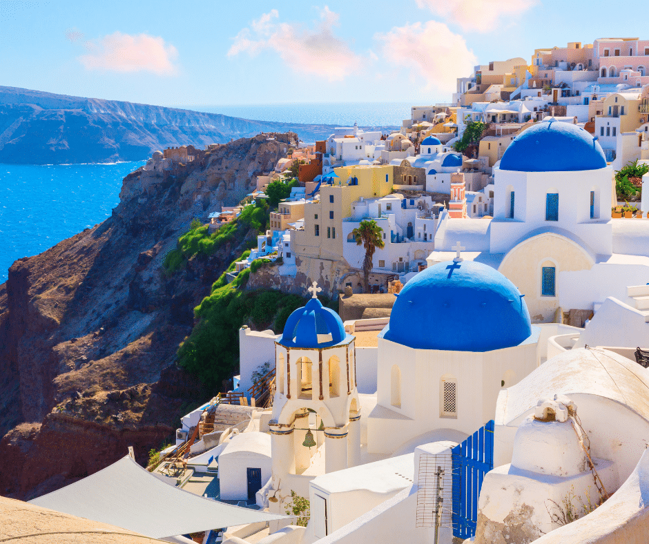 Iconic view along a 10 day Greece itinerary: Santorini Island with clifftop villages and caldera overlooking the Aegean Sea