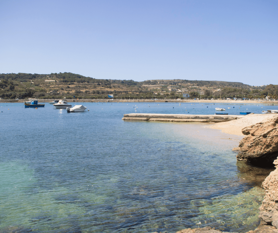 rocky shore beach, and sea St. Paul's Bay in Malta