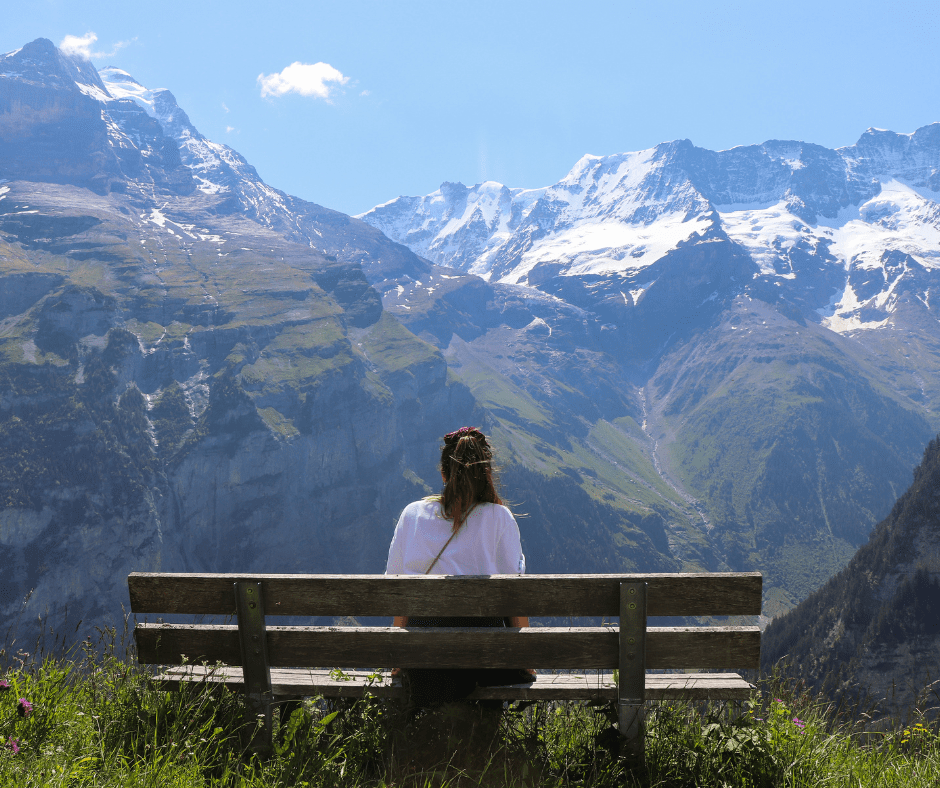 traveler scouting alps for travel photos