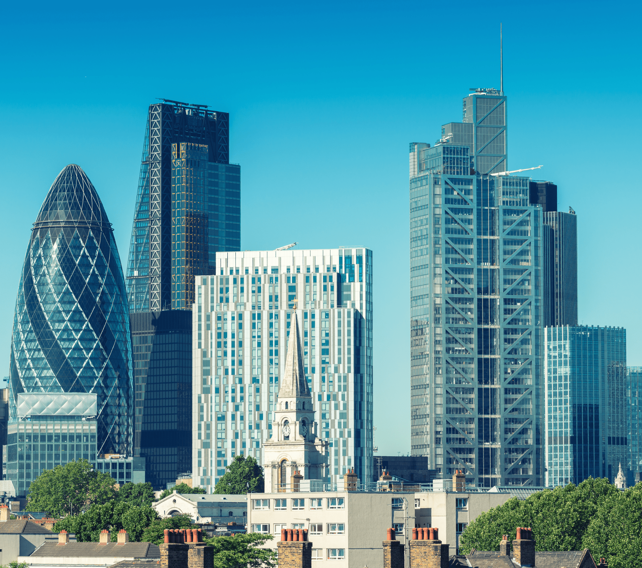 Panoramic view of the City of London skyline, featuring iconic landmarks like the Gherkin and Tower Bridge, representing an ideal destination for urban explorers seeking culture, history, and modern city life.