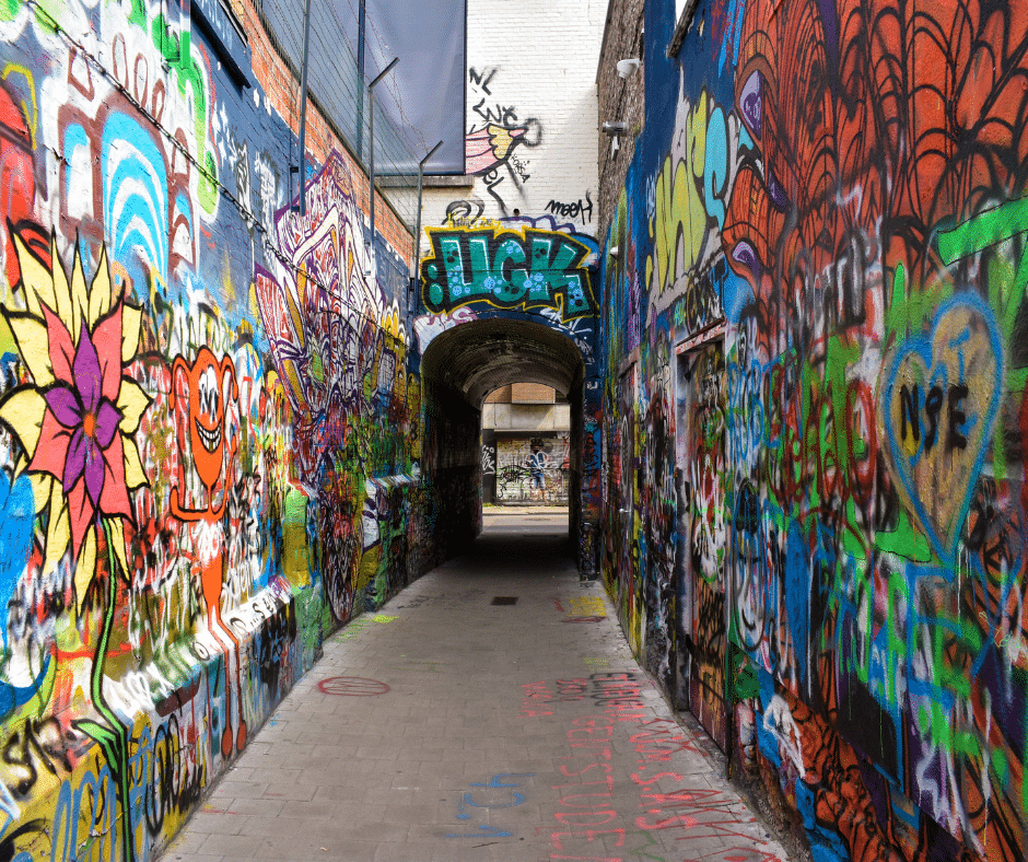 Colorful street art covering the walls of Ghent’s Graffiti Alley (Werregarenstraat), a dynamic open-air gallery in the city center.