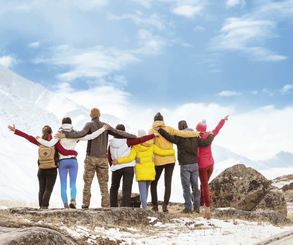 A group of friends enjoying an adventure on a mountain, highlighting the need for premium travel insurance to cover outdoor activities and ensure comprehensive protection during high-risk trips.
