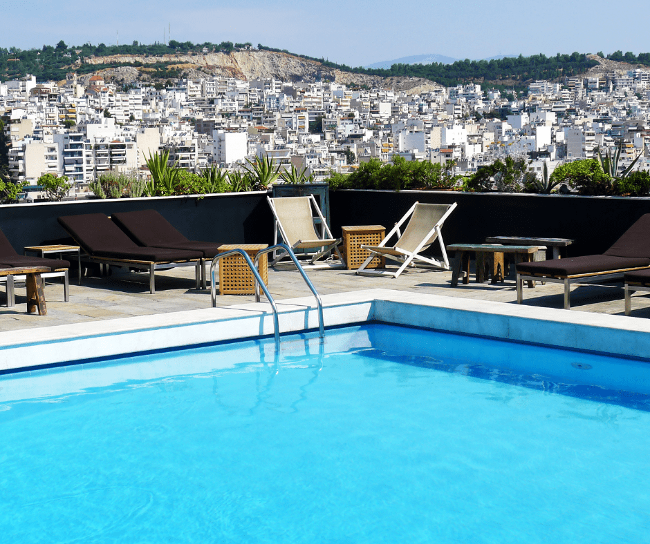 Luxury moment during a 10 day Greece itinerary: hotel pool overlooking the Athens skyline 