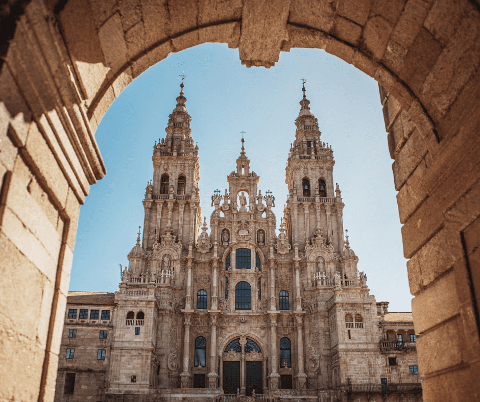 View of Santiago de Compostela, Spain, featuring the ornate facade of the Santiago Cathedral, a key pilgrimage destination at the end of the Camino de Santiago.