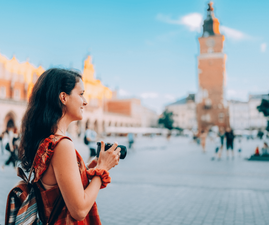 tourist woman with camera exploring europe