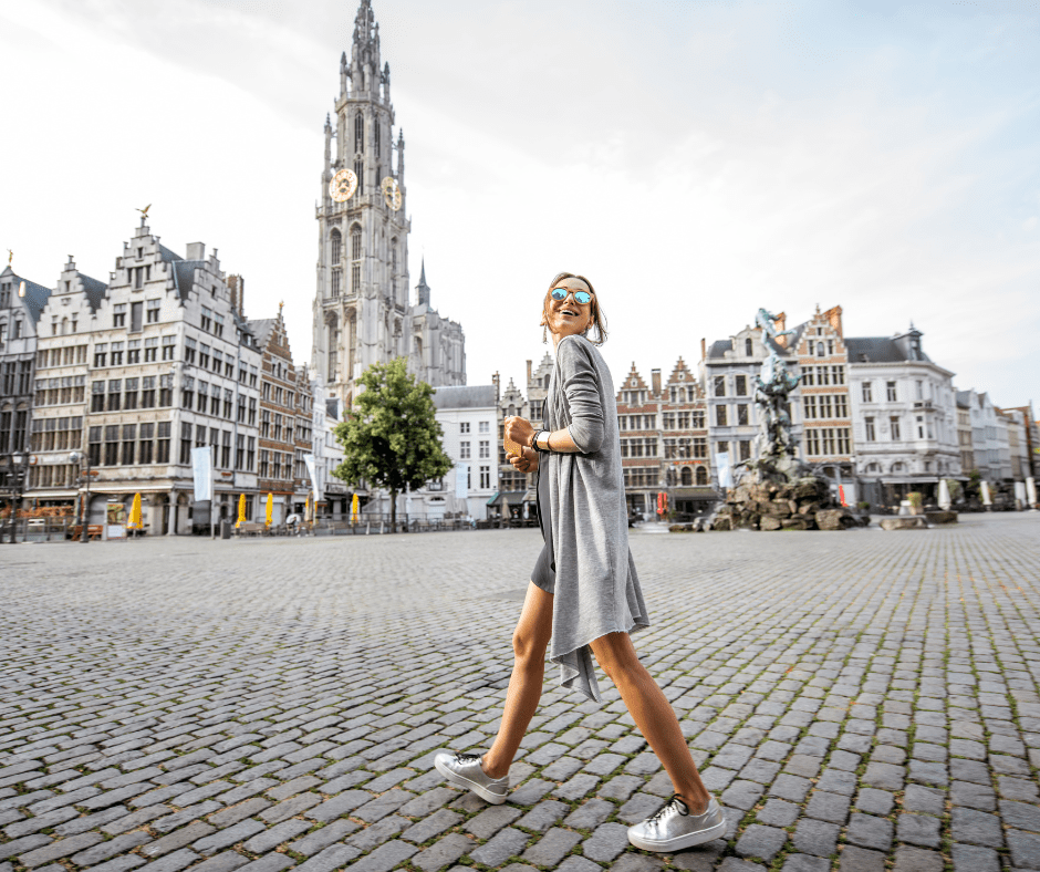 Solo traveler walking through Antwerp’s historic city center, representing independent travel in Europe.